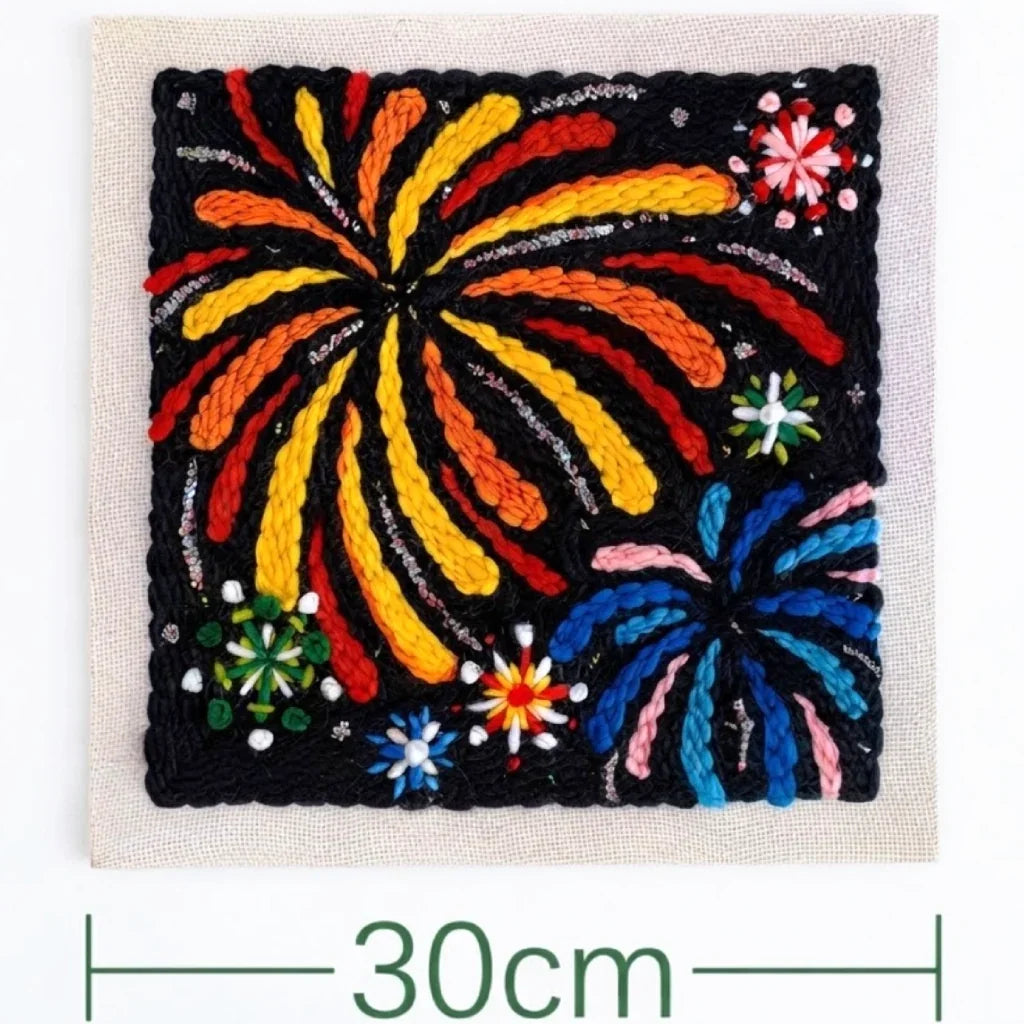 Bright fireworks embroidery design in a Calivra Craft punch needle kit.