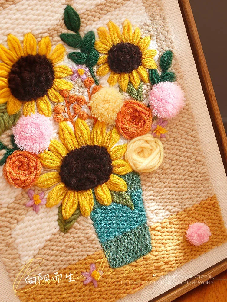 Calivra Craft sunflower punch needle kit featuring a colorful floral bouquet in a vase.