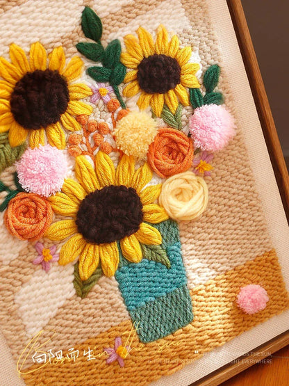 Calivra Craft sunflower punch needle kit featuring a colorful floral bouquet in a vase.