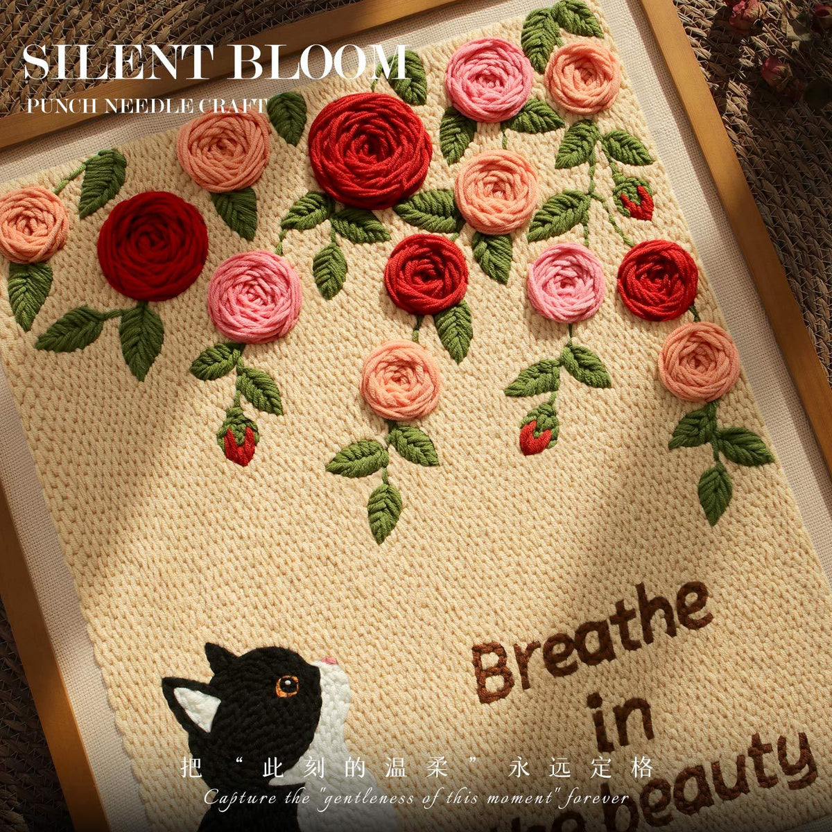 Calivra Craft punch needle kit featuring a cat and red and pink rose garden design.