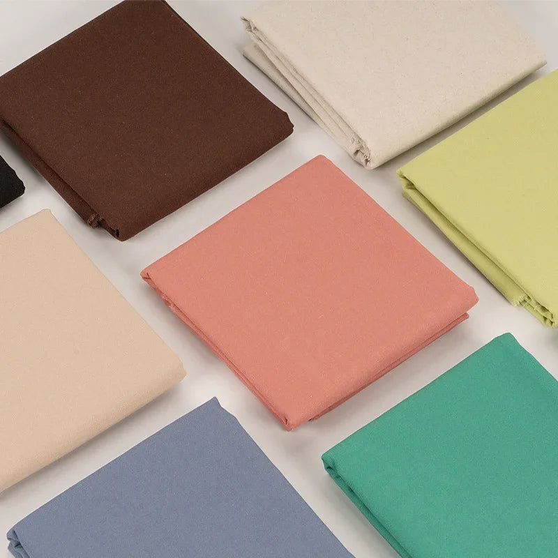 Assorted colorful Calivra Craft cotton linen embroidery fabric swatches.
