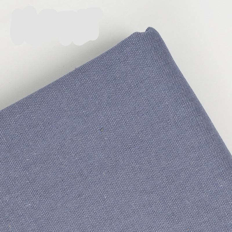 Close-up texture of Calivra Craft blue cotton linen embroidery fabric.