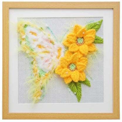 Butterfly DIY embroidery kit featuring yellow flowers and white butterfly wings on fabric.