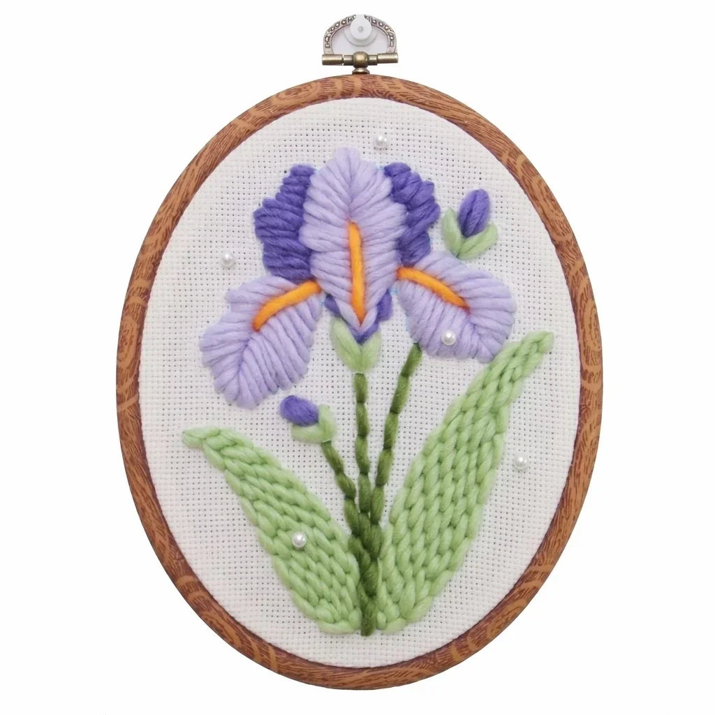 Purple iris flower punch needle embroidery kit in a wooden hoop by Calivra Craft
