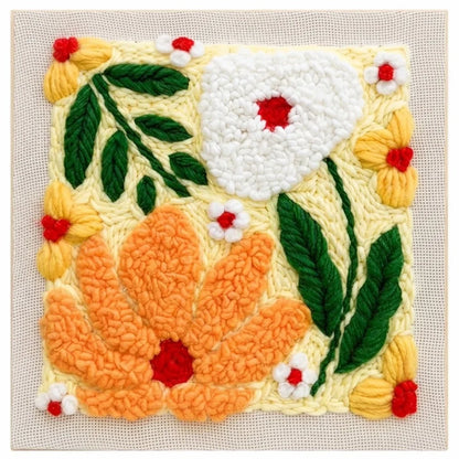 Punch needle embroidery kit featuring a colorful floral pattern with large white and orange flowers.