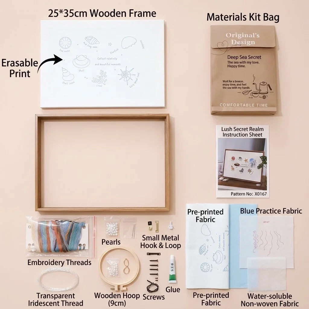 Ocean DIY fabric embroidery material kit with wooden frame, threads, and pearls.