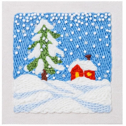 Winter landscape embroidery kit by Calivra Craft featuring a snowy tree and small red house.