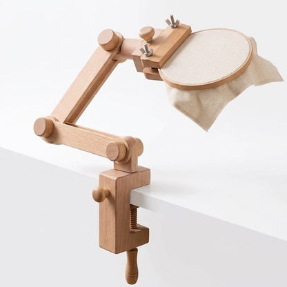 Calivra Craft multi-joint wooden embroidery hoop stand clamped to a white table