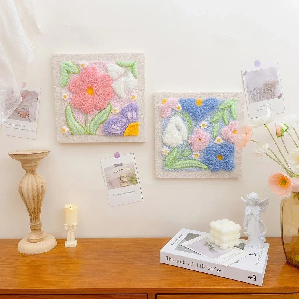 Calivra Craft DIY punch needle embroidery kits featuring colorful floral designs on a desk.