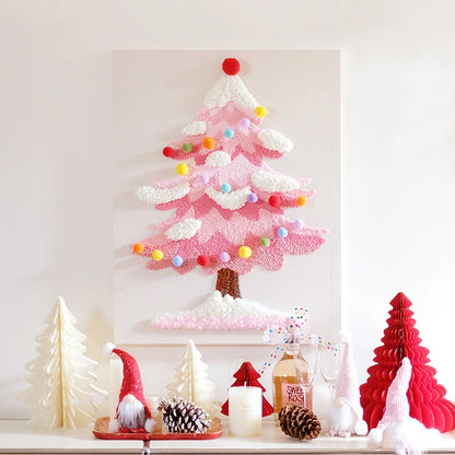 Pink punch needle embroidery Christmas tree art with colorful ornaments on a white background.