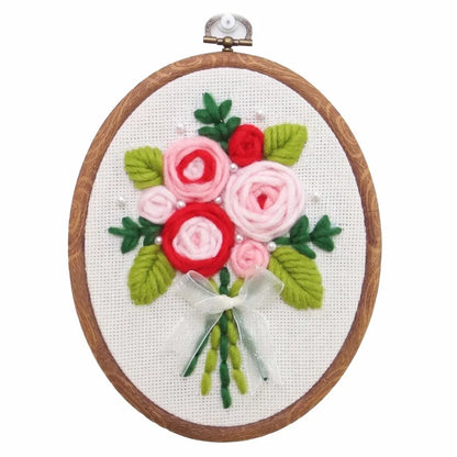 Calivra Craft punch needle embroidery kit featuring pink and red 3D flowers in a wooden hoop