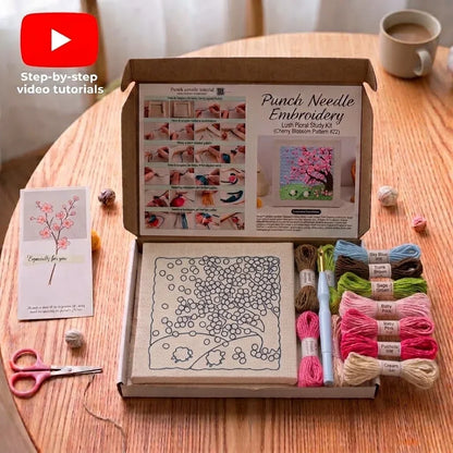 Calivra Craft Punch Needle Embroidery kit with cherry blossom pattern, threads, and tools.