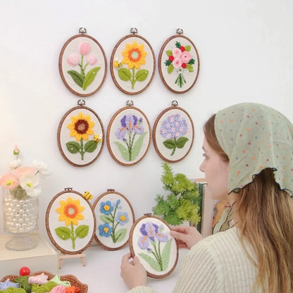 Woman crafting flower DIY punch needle embroidery kits from Calivra Craft.