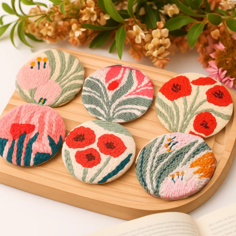 Floral-patterned cookies on a wooden board with flowers in the background