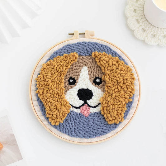Punch Needle hoop with a dog face design on a white background