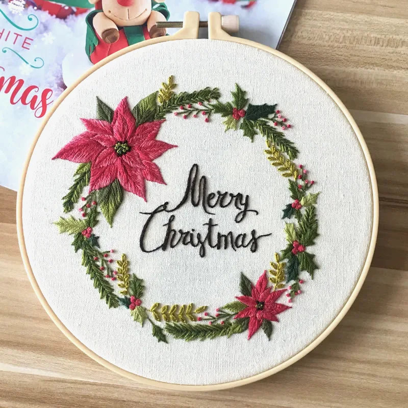 This elegant embroidery design features a festive Christmas wreath adorned with vibrant poinsettias, holly leaves, and golden sprigs. The “Merry Christmas” lettering at the centre adds a joyful and classic holiday touch. Perfect for decorating your home or gifting to loved ones during the festive season.