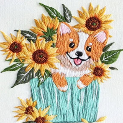 Embroidered design of a corgi with sunflowers on a white background