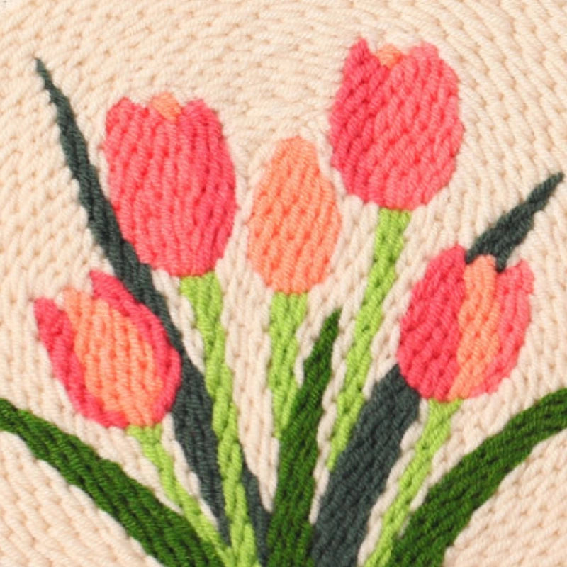 Embroidered design of pink tulips on a beige background