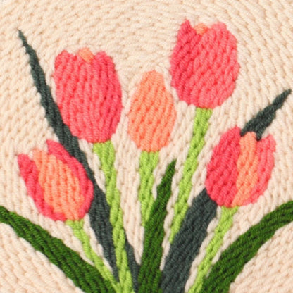 Embroidered design of pink tulips on a beige background