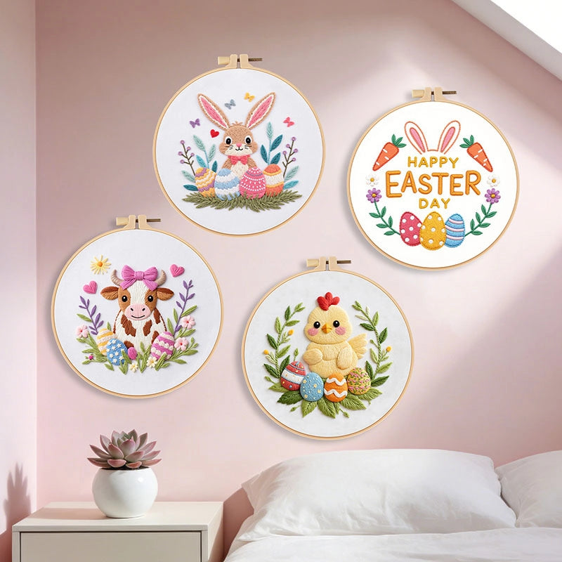 Four embroidered hoop art pieces with Easter-themed designs on a wall.