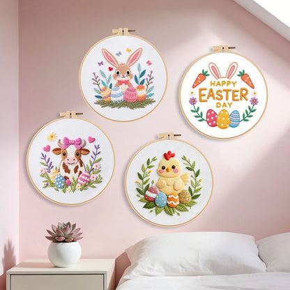 Four embroidered hoop art pieces with Easter-themed designs on a wall.