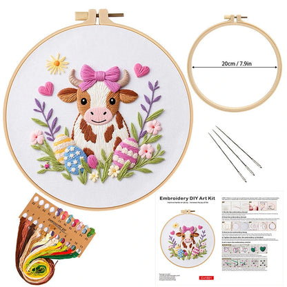 This adorable embroidery kit features a sweet, smiling cow adorned with a pink bow, surrounded by colorful Easter eggs and blooming flowers. The design’s playful and charming elements, paired with pastel shades and detailed stitching, make it a perfect addition to your Easter décor. Celebrate the season with this whimsical and heartwarming kit, ideal for bringing joy and a touch of spring to any space.