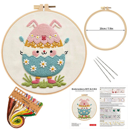 This adorable embroidery kit features a cheerful egg character with bunny ears and a bright, pastel-colored design. Surrounded by sweet daisies and soft grass, it brings a playful and joyful atmosphere to your spring décor. With its charming details and vibrant stitching, this DIY kit offers a fun and creative way to celebrate Easter and the beauty of the season.