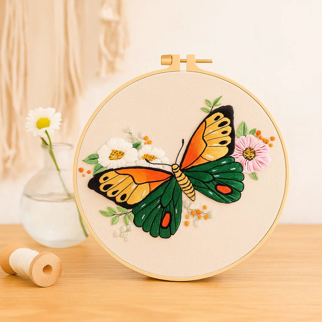 Embroidery hoop with a butterfly design on a wooden surface