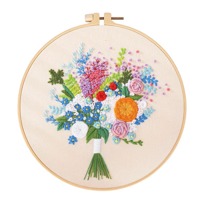 Embroidery hoop with a colorful floral bouquet design on a white background