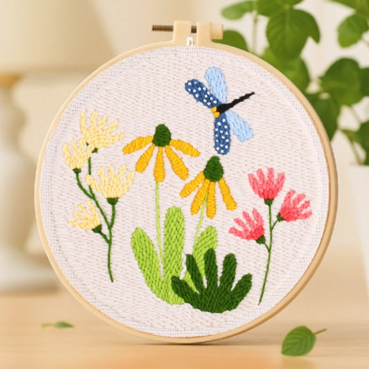 This embroidery design, “Garden Dance,” depicts a blue dragonfly gracefully hovering above bright yellow and pink blossoms. The fresh green leaves and soft pastel tones create a peaceful, nature-inspired composition. With its simple stitches and cheerful colors, it’s a perfect beginner-friendly project that brings a touch of springtime joy to your home or makes a lovely handmade gift.