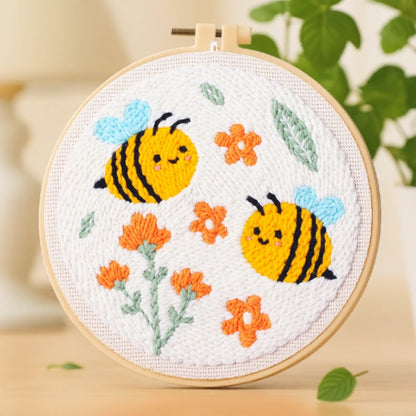 Two cheerful bees buzz joyfully among blooming orange flowers. The bright colors and cute design make this embroidery pattern full of warmth and charm — simple, fun, and perfect for beginners.