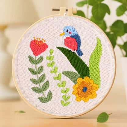 This embroidery design features a charming little bird perched among bright flowers and lush green leaves. The colorful palette of red, blue, yellow, and green brings a cheerful touch to the piece. Easy to stitch and beginner-friendly, it’s perfect for adding a bit of nature-inspired beauty to your home or gifting to a friend who loves handmade art.