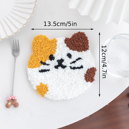 Cat-shaped decorative item with measurements on a white plate with a fork and glass.