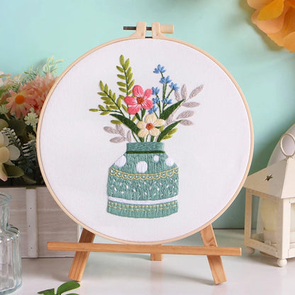 Meadow Harmony captures the tranquil charm of wildflowers gathered in a soft green vase. The gentle blend of red, blue, and cream tones reflects the balance of nature — calm, vibrant, and full of life. A perfect piece to bring a refreshing touch of the countryside into your home.