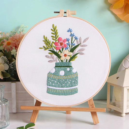 Meadow Harmony captures the tranquil charm of wildflowers gathered in a soft green vase. The gentle blend of red, blue, and cream tones reflects the balance of nature — calm, vibrant, and full of life. A perfect piece to bring a refreshing touch of the countryside into your home.