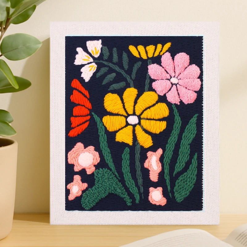 This design features vivid flowers in yellow, pink, red, and white blooming against a deep navy background, creating a striking and elegant contrast.