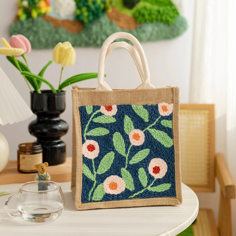 Soft peach blossoms and fresh green leaves bloom against a deep navy background, creating a calm yet lively design inspired by a quiet garden under the moonlight.