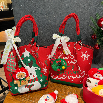 Two festive red Christmas tote bags with holiday patterns and decorative charms.