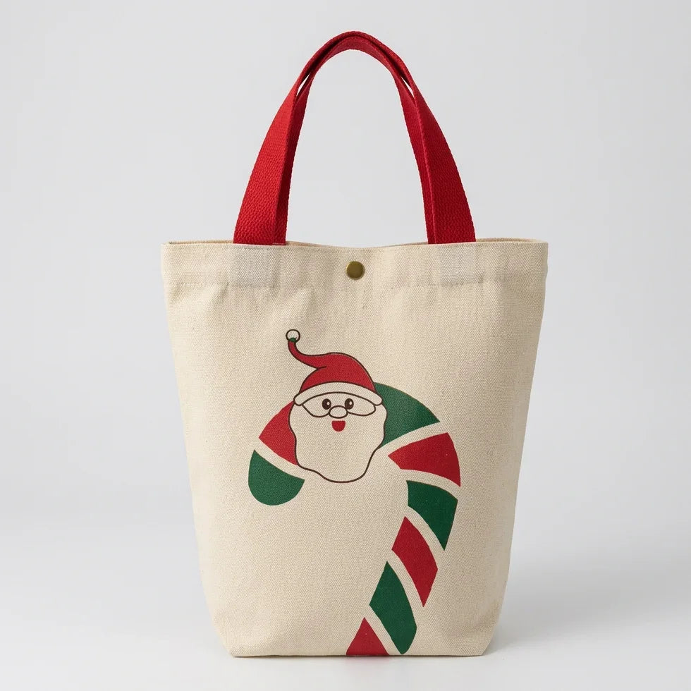 Christmas canvas gift bag with Santa Claus and candy cane design and red handles
