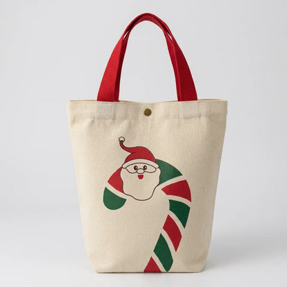 Christmas canvas gift bag with Santa Claus and candy cane design and red handles