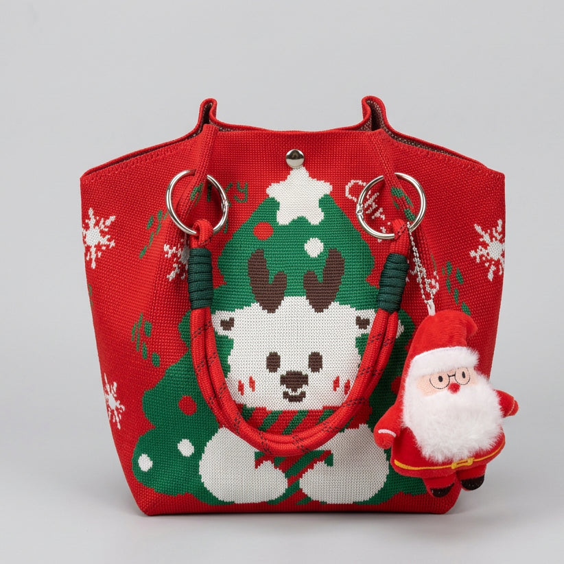 Christmas tote bag with reindeer and Santa Claus charm for holiday gifting.