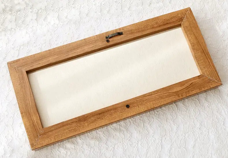 Back view of a rectangular wooden embroidery hoop frame for Calivra Craft 3D plant kits.