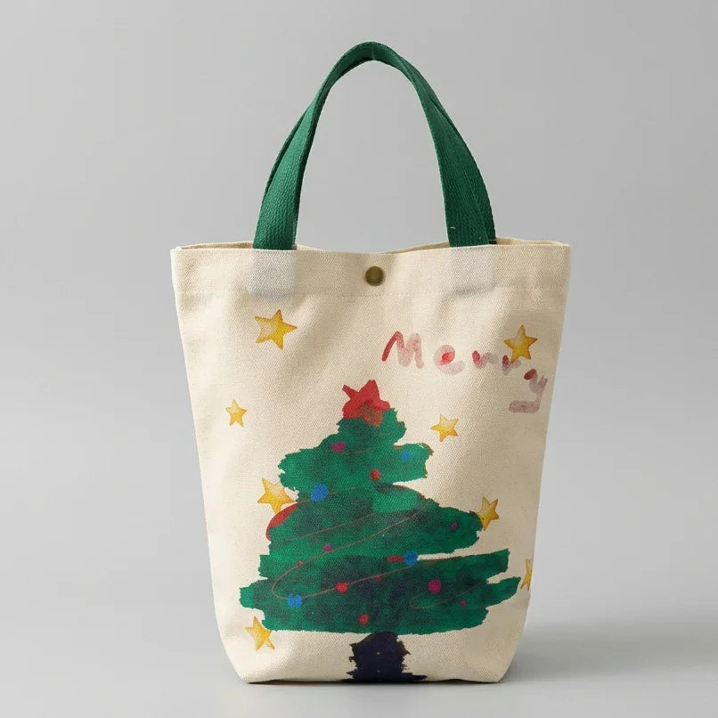 Christmas canvas gift bag featuring a decorated green tree design with green handles.