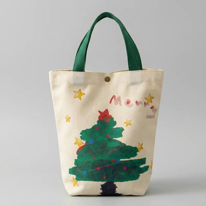 Christmas canvas gift bag featuring a decorated green tree design with green handles.