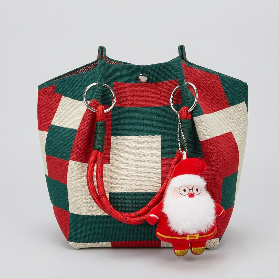Christmas knitted tote bag with red and green checkered pattern and Santa Claus charm.