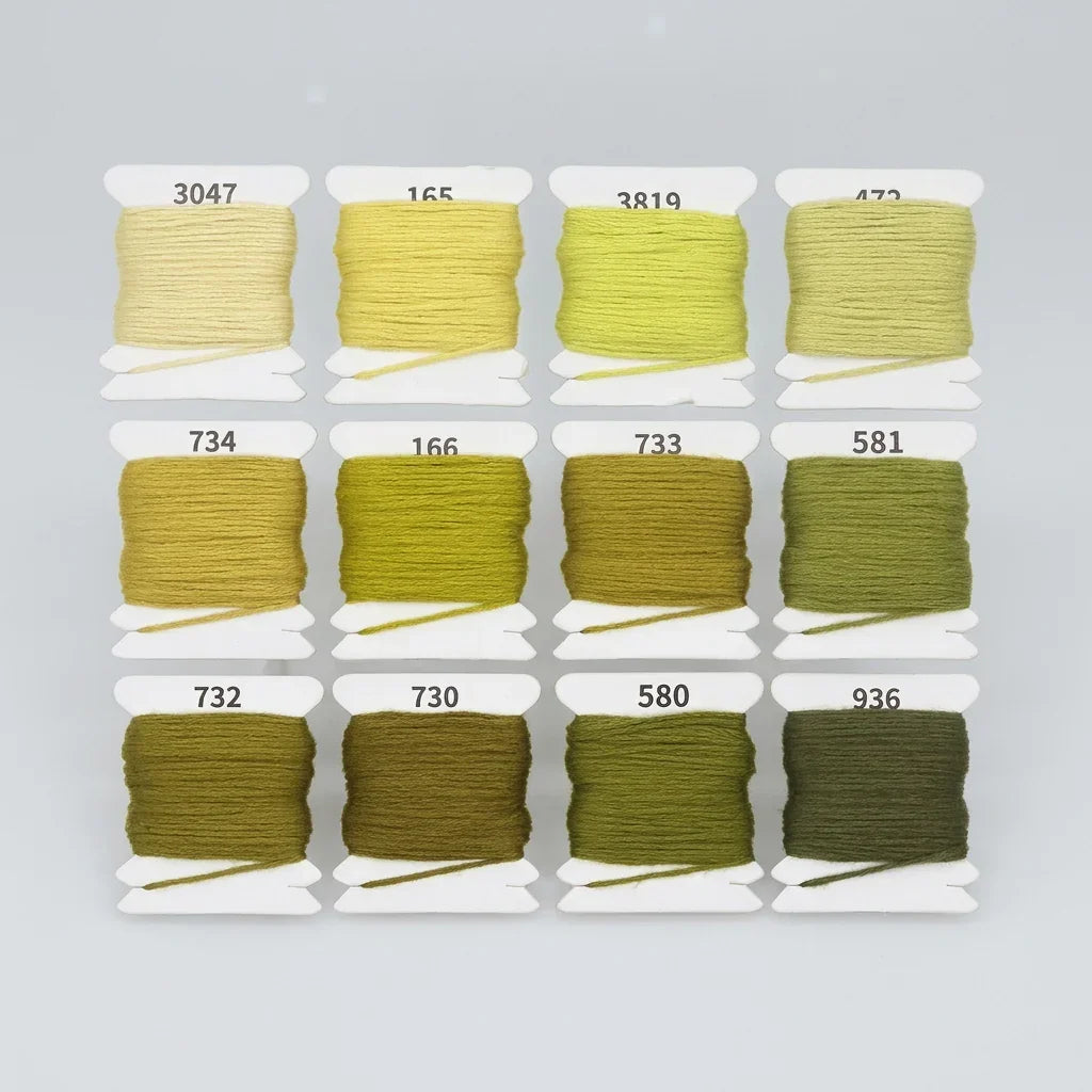 12 colors of gradient green cotton embroidery floss skeins with numbered labels.