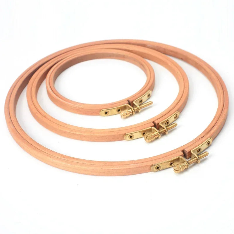 Set of three premium beech wood embroidery hoops with brass screw adjustments.