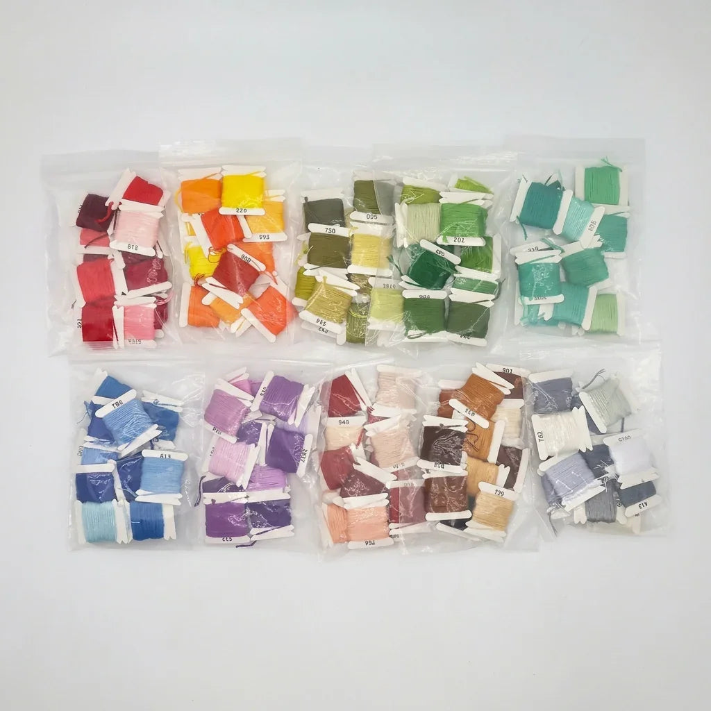 Assorted packs of 12-color gradient 6 strand cotton embroidery floss sets by Calivra Craft.