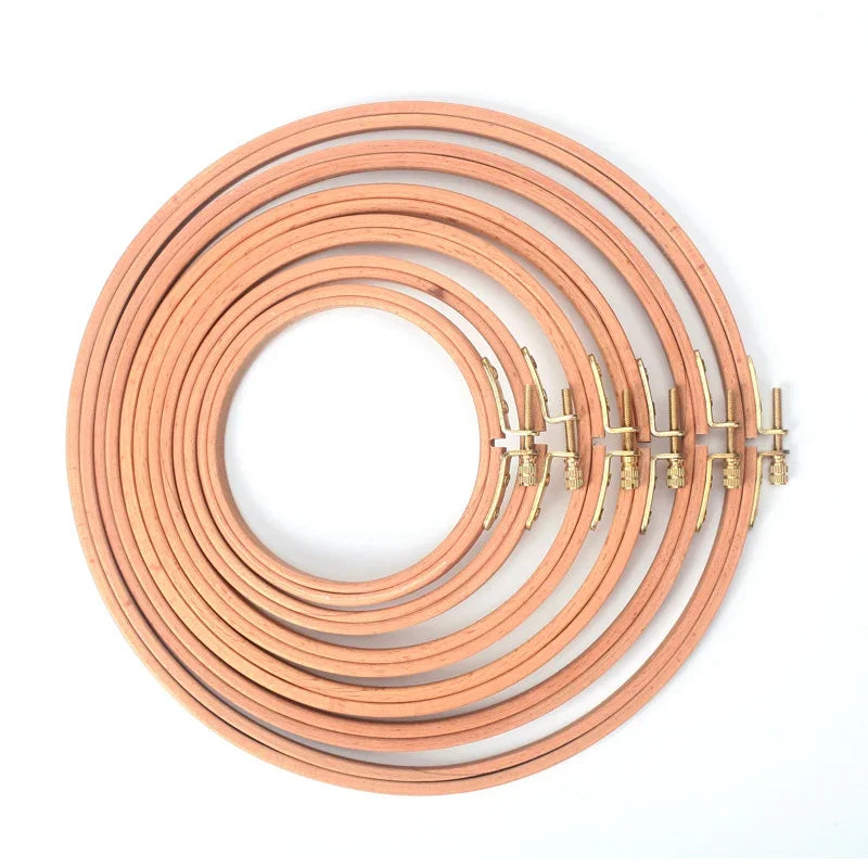 Set of premium beech wood embroidery hoops with gold-toned metal fasteners.