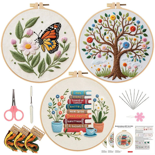 Embroidery DIY art kit featuring three floral patterns with threads, needles, and scissors